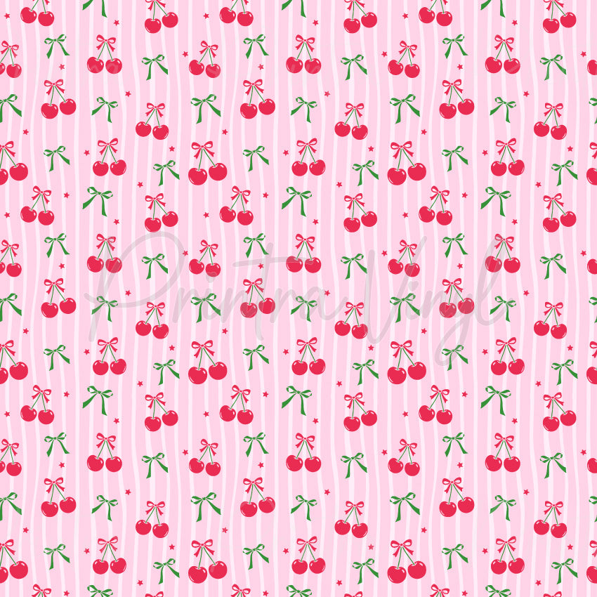 Bow-Cherry Chic patterned vinyl featuring sweet red cherries tied with pink ribbon bows, delicate green bows, and tiny star accents arranged over soft pink vertical stripes.