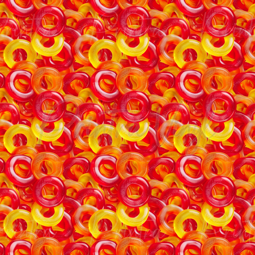 Candy Shop #05 patterned vinyl featuring vibrant red, orange, and yellow gummy ring lollies layered into a colourful candy-filled design with glossy textures and bright confectionery details.