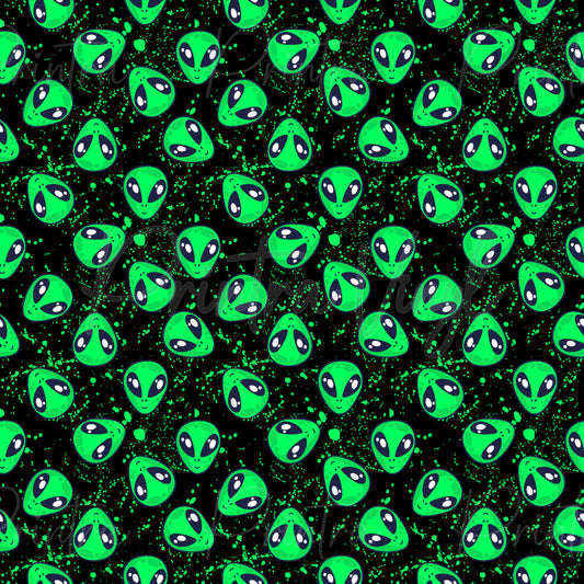 Alienation patterned vinyl featuring bright neon green alien heads scattered across a black background with vibrant green paint splatter effects, creating a bold and playful extraterrestrial design.
