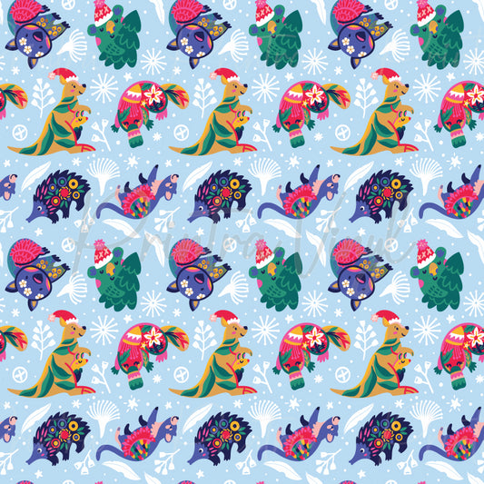 Aussie Christmas #01 patterned vinyl featuring colourful Australian wildlife including kangaroos, koalas, echidnas, wombats, cockatoos, and emus dressed in festive Christmas accessories, surrounded by native botanical elements, snowflakes, and holiday details on a soft blue background.