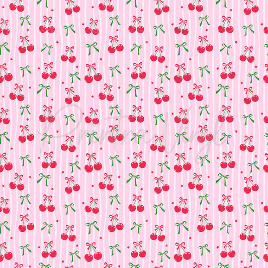 Bow-Cherry Chic patterned vinyl featuring sweet red cherries tied with pink ribbon bows, delicate green bows, and tiny star accents arranged over soft pink vertical stripes.