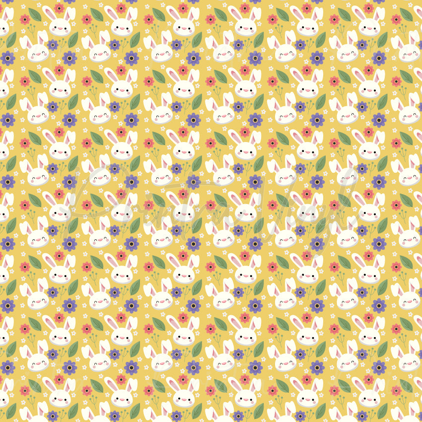 Bunny Blossom patterned vinyl featuring adorable white bunny faces surrounded by pink and purple flowers, green leaves, and tiny floral accents on a warm golden yellow background.