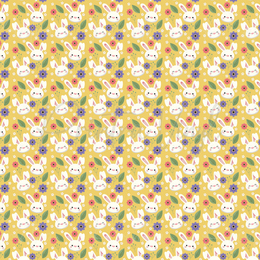 Bunny Blossom patterned vinyl featuring adorable white bunny faces surrounded by pink and purple flowers, green leaves, and tiny floral accents on a warm golden yellow background.
