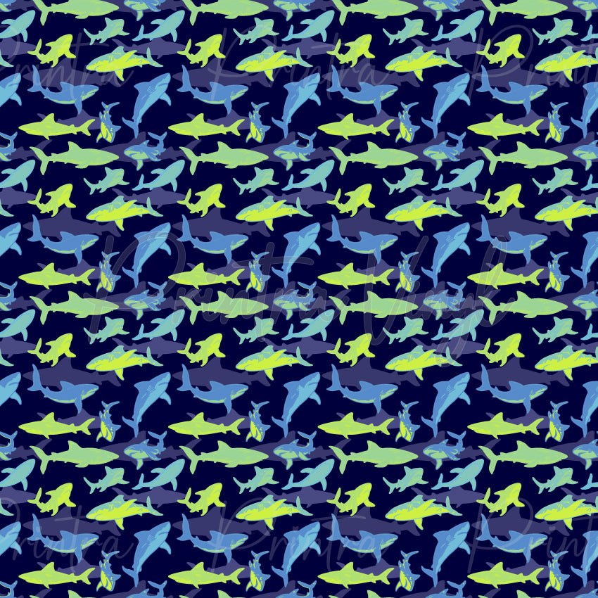 Fin Frenzy patterned vinyl featuring a lively collection of sharks, whales, dolphins, hammerhead sharks, and other ocean predators in bright blue and lime green tones scattered across a deep navy background.