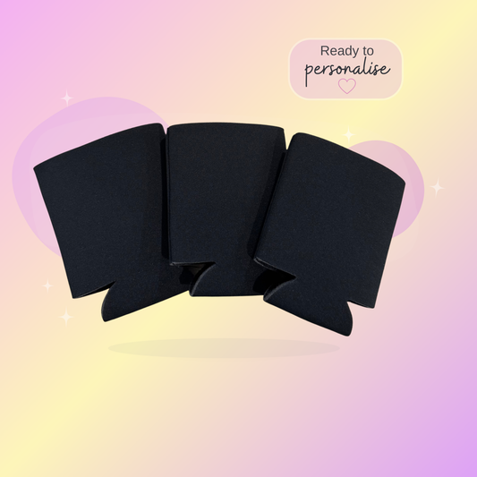 Black can coolers on a gradient pink and yellow background with text 'Ready to personalise'.