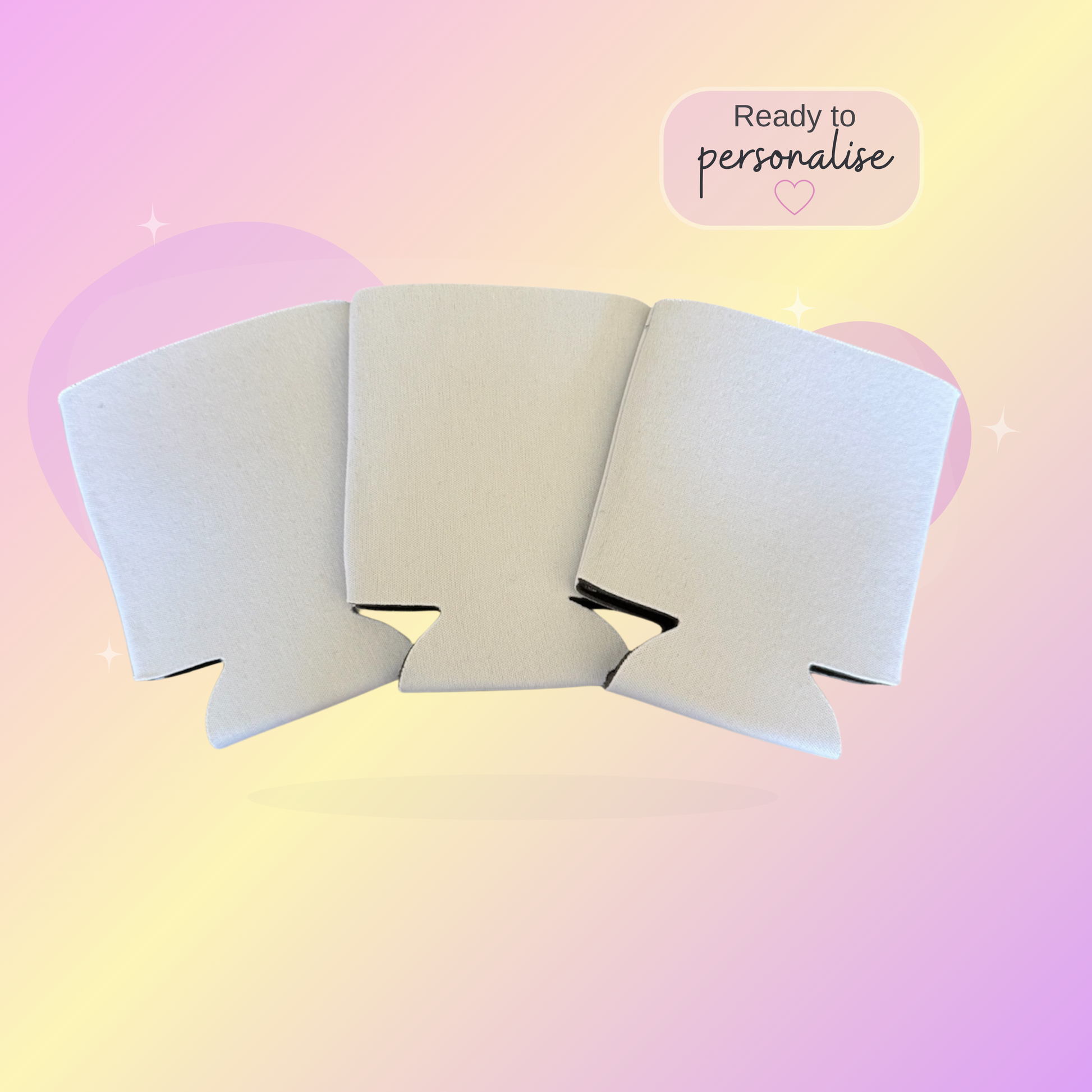 White stubby coolers on a pastel gradient background with text 'Ready to personalise'.