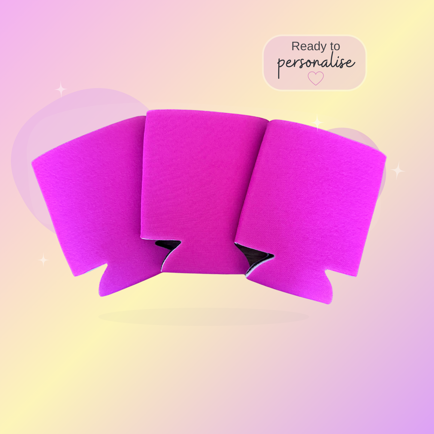 Pink stubby coolers on a pastel gradient background with text 'Ready to personalise'.