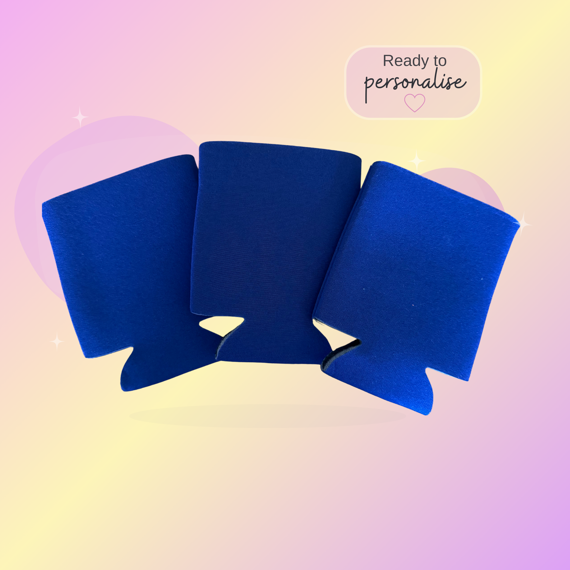 Royal Blue stubby coolers on a pastel gradient background with text 'Ready to personalise'.